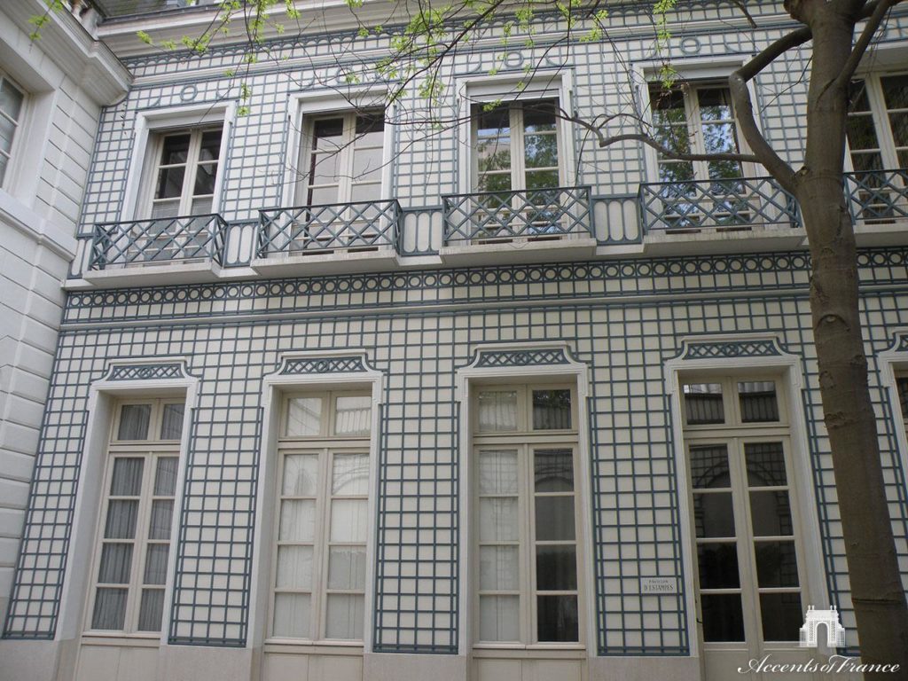 The back facade of a residential property is made more interesting when covered with decorative latticework.